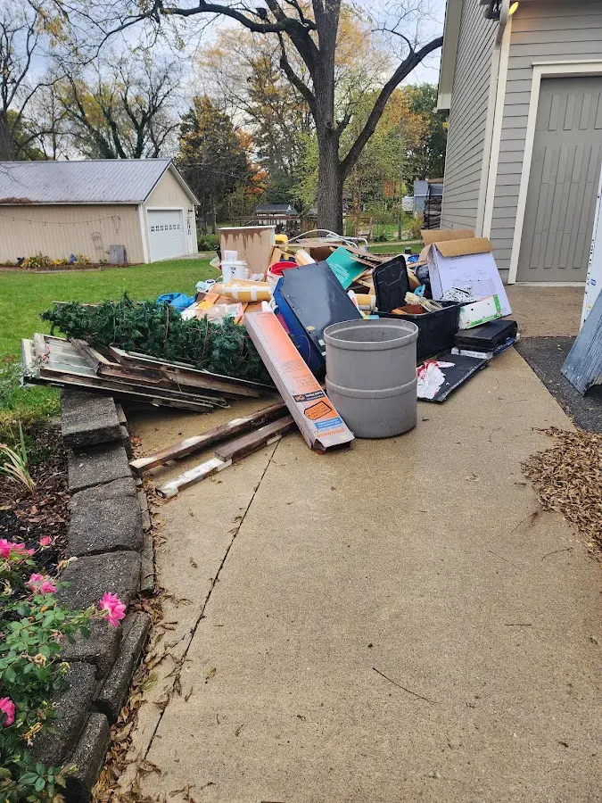 Dumpster being loaded with debris for Commercial Dumpster Rental in Shelby